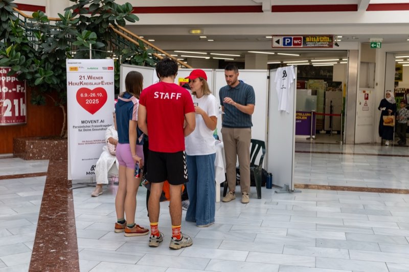 Movent team on stage at Lugner City presenting the t-shirt
