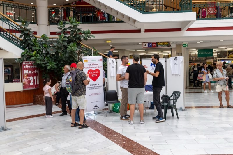 Movent team engaging with visitors at the booth